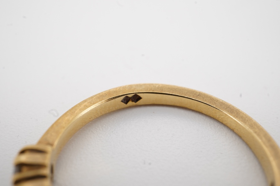 A modern 18ct gold and seven stone diamond set half hoop ring size O, gross weight 3.2 grams.